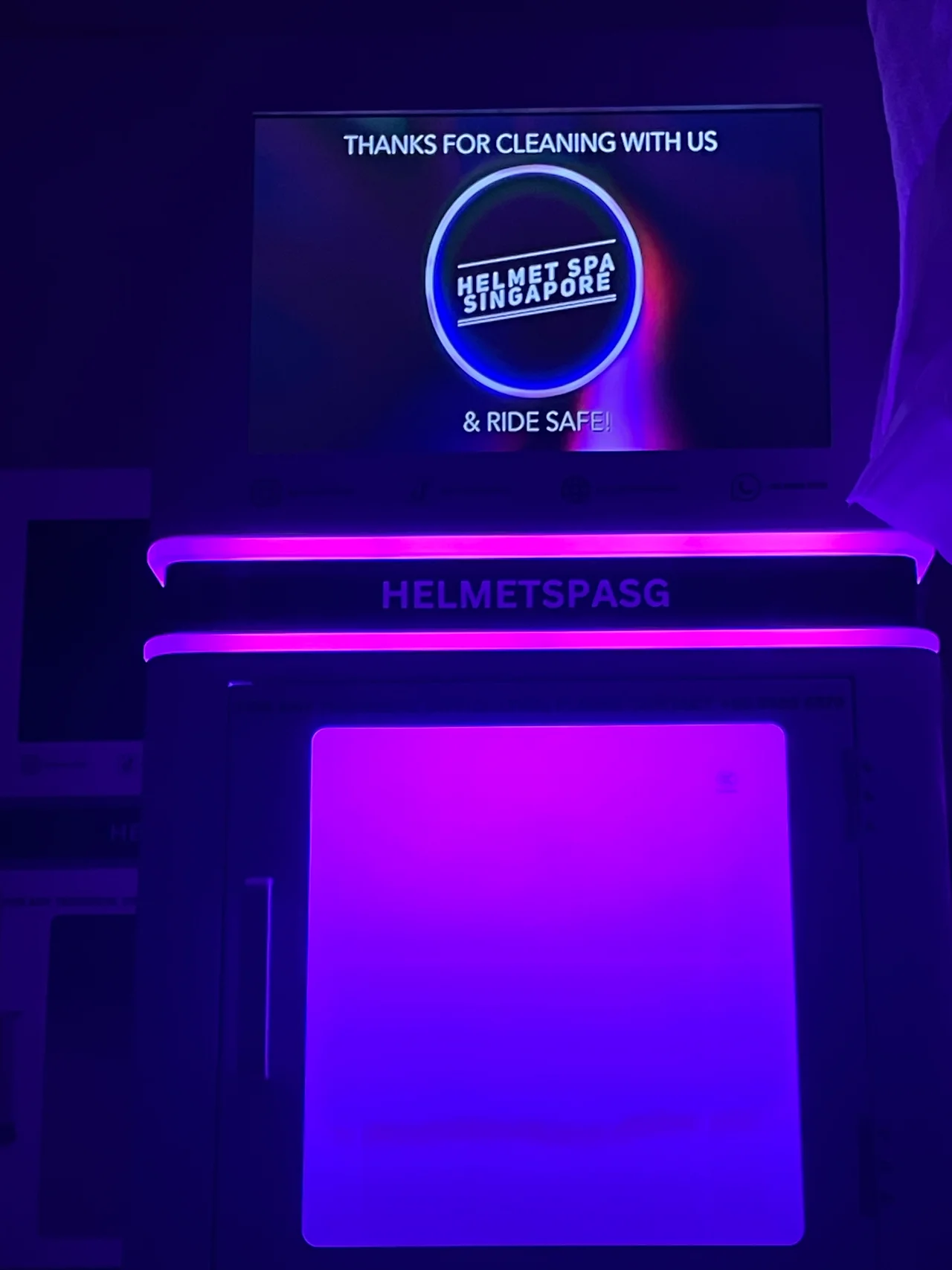 Helmet Spa Indonesia smiling in a red plaid shirt and tortoise shell glasses